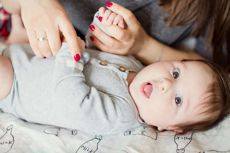 Little boy holding hands his mother. Holding hands. Mother love