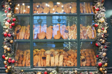 Christmas bakery showcase and Christmas garlandの写真素材