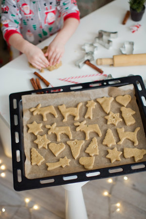 Christmas baking background: dough, cookie cutters, spices and Christmas decorations. Christmas...