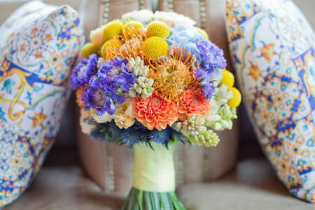 Bright colorful italy wedding bouquet with orange, yellow, white and blue flowers. Sicily wedding conceptの写真素材