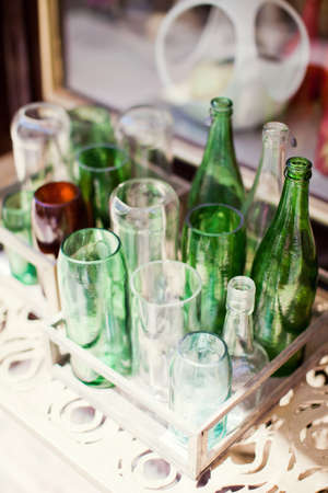 Wine bottles glass vases on the shelf. Decoration diy vasesの写真素材