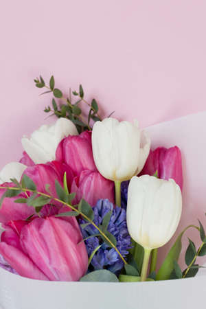 Beautiful spring bouquet on a pink background with copy space, place for text. Spring holiday...