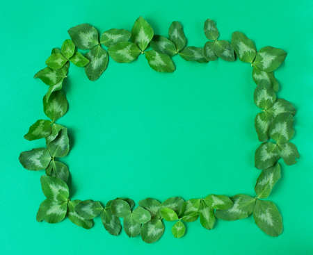 Saint patricks day concept. Rectangle clower frame on a green background