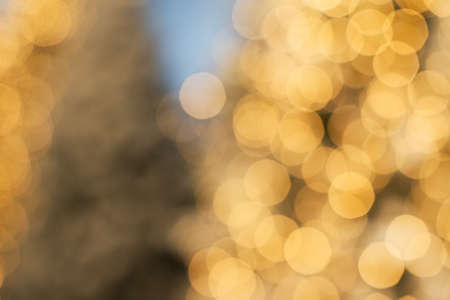 Background with blurred bokeh golden lights. Christmas background concept, copy spaceの写真素材