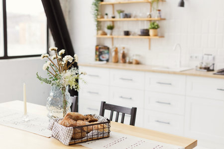 White kitchen interior with wooden details in furnitureの写真素材