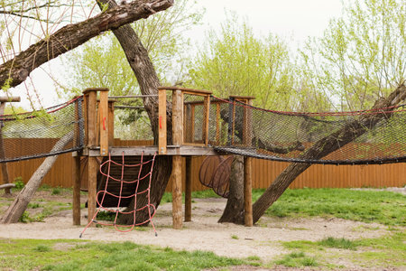 Wooden playground outdoors in the spring parkの写真素材