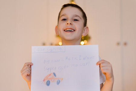 Caucasian boy with letter to Santaの写真素材