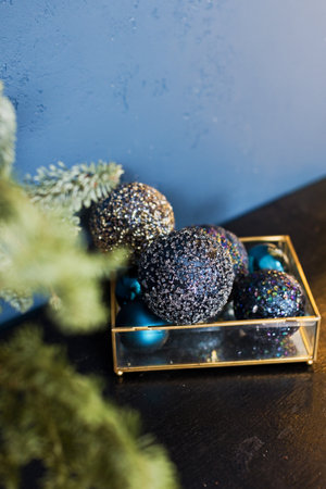 Vintage Christmas decorations in glass box on a blue backgroundの写真素材