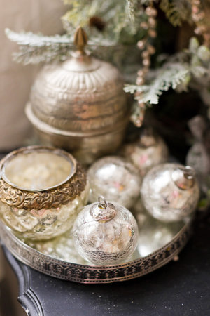 Vintage Christmas decorations on a silver trayの写真素材