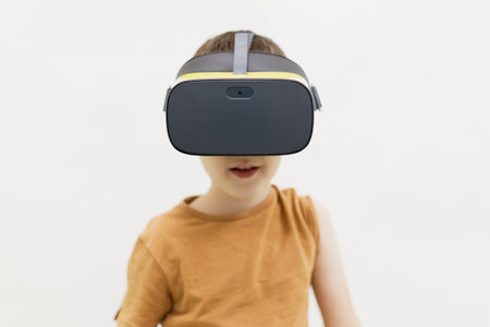 Caucasian boy in vr glasses, copy space