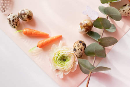 Frame border with Easter decorations on a pink background, copy spaceの写真素材