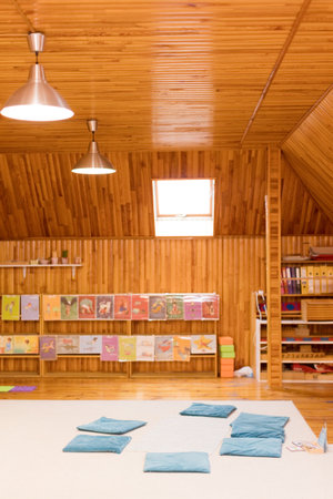 Cozy reading and relaxation space with cushions and educational materialsの写真素材