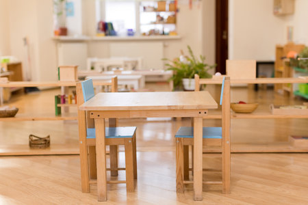 Wooden table and chairs in a Montessori learning environmentの写真素材