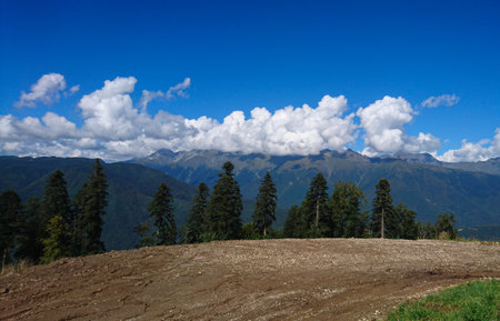 A view of a mountain range with a road winding through it, featured on unsplash, hurufiyya, panorama, hdrの写真素材