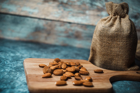 Almond nuts on the wooden board. High quality photoの写真素材