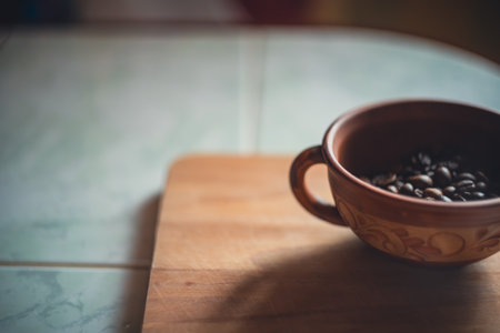 Coffee beans in a clay cup. High quality photo