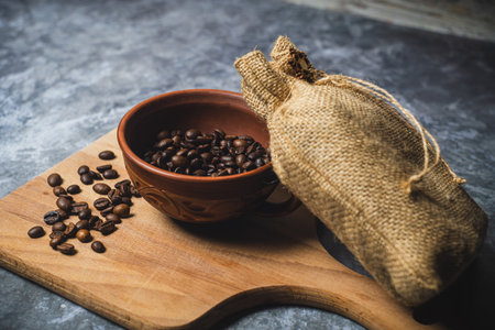 Coffee beans in a clay cup. High quality photoの写真素材