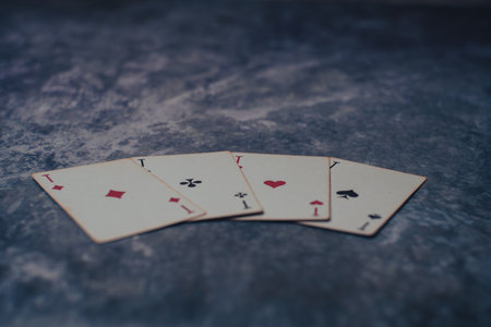 Gloomy photo of playing cards on a marble table. High quality photo