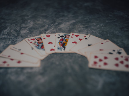 Gloomy photo of playing cards on a marble table. High quality photo