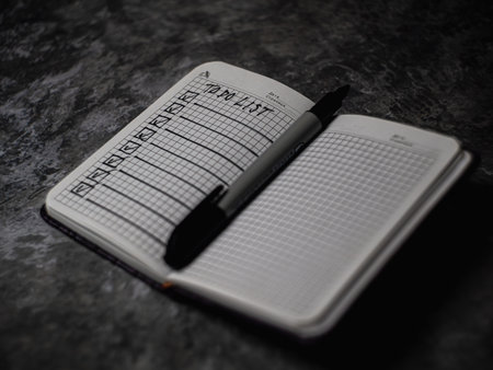 Notepad with a list of cases. High quality photo