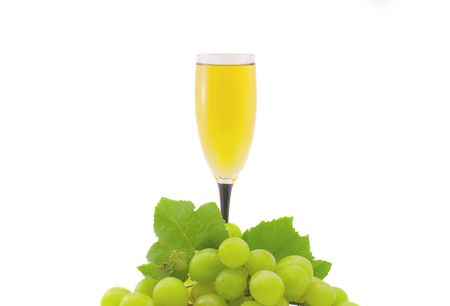 Glass of white wine and grapes isolated on a white backgroundの写真素材