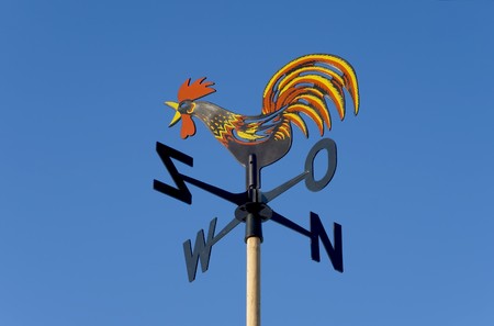 Weather vane against the blue skyの写真素材