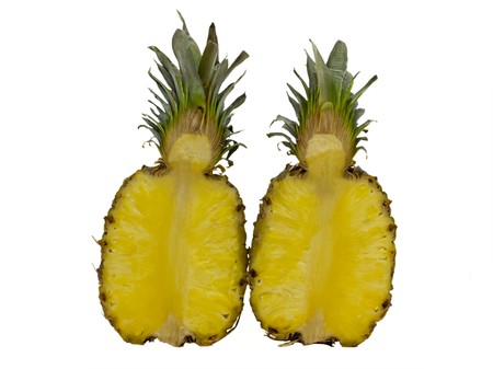 Two halves of pineapple isolated on a white background