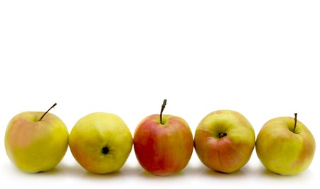 Five apples laid out horizontally in the bottom of a picture