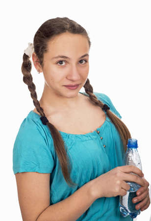 Portrait of the young girl with a water bottle in handsの写真素材