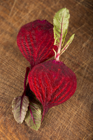 beet with leaves on a wooden backgroundの写真素材