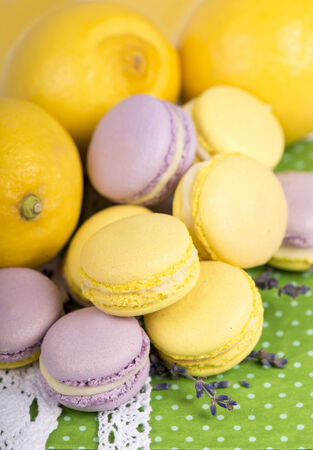 Pastel color macaroons in vintage round box on a wooden backgroundの写真素材