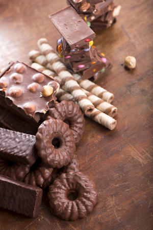 gingerbread cookies and chocolate on a wooden backgroundの写真素材