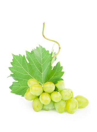 Green grape with leaves isolated on white.の写真素材