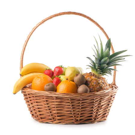 Fresh fruit in the basket against a white backgroundの写真素材