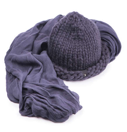 Gray cap and warm scarf on a white background.の写真素材