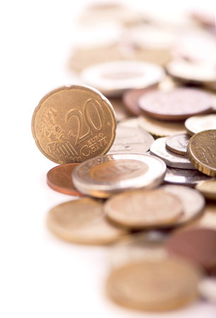 Coins of different countries on a white backgroundの写真素材