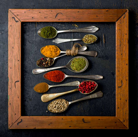 Various spices spoons on table. Top view with copy spaceの写真素材