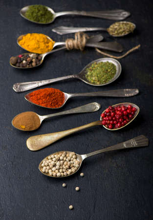 Various spices spoons on table. Top view with copy spaceの写真素材