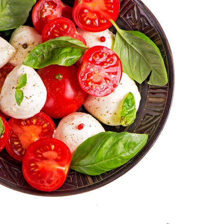 mozzarella cheese with cherry tomatoes and basil.の写真素材