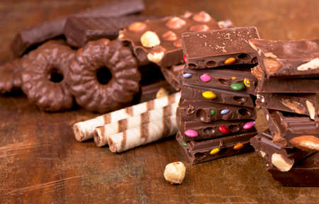 gingerbread cookies and chocolate on a wooden background