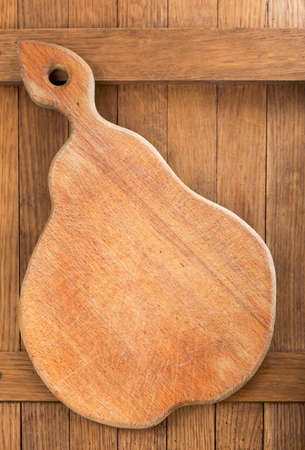 wood olive cutting board on dark wooden table