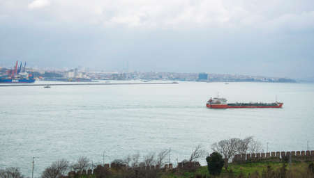 Large cargo ship tanker in the Bosphorus Strait in Istanbul, freight water transport concept