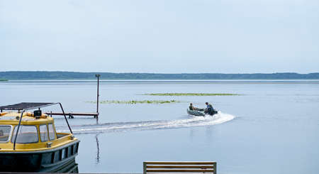 Motor boats moored at the pierの写真素材