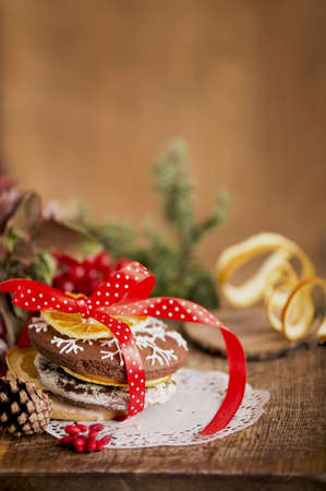 Christmas decoration with cookies and spices on an old wooden background.
