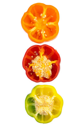 colored peppers over white background
