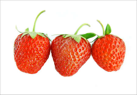 Three berries of a strawberry on a white background.の写真素材