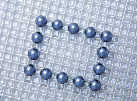  Rectangular framework from steel spheres on  metal background