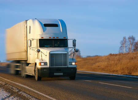 big supersize truck with  trailer goes on highwayの写真素材