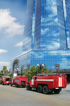 Fine-engine vehicles near office building in city centre