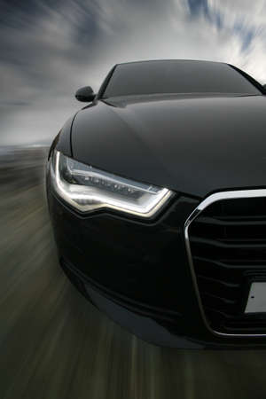 powerful sports car goes on roadの写真素材